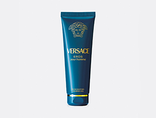Produktbild des 'Versace Eros pour homme' Duschgels. Die Tube ist in dunklem Türkisblau mit goldener Aufschrift und dem Versace-Medusakopf-Logo gestaltet. Der Hintergrund ist hellgrau und schlicht gehalten.